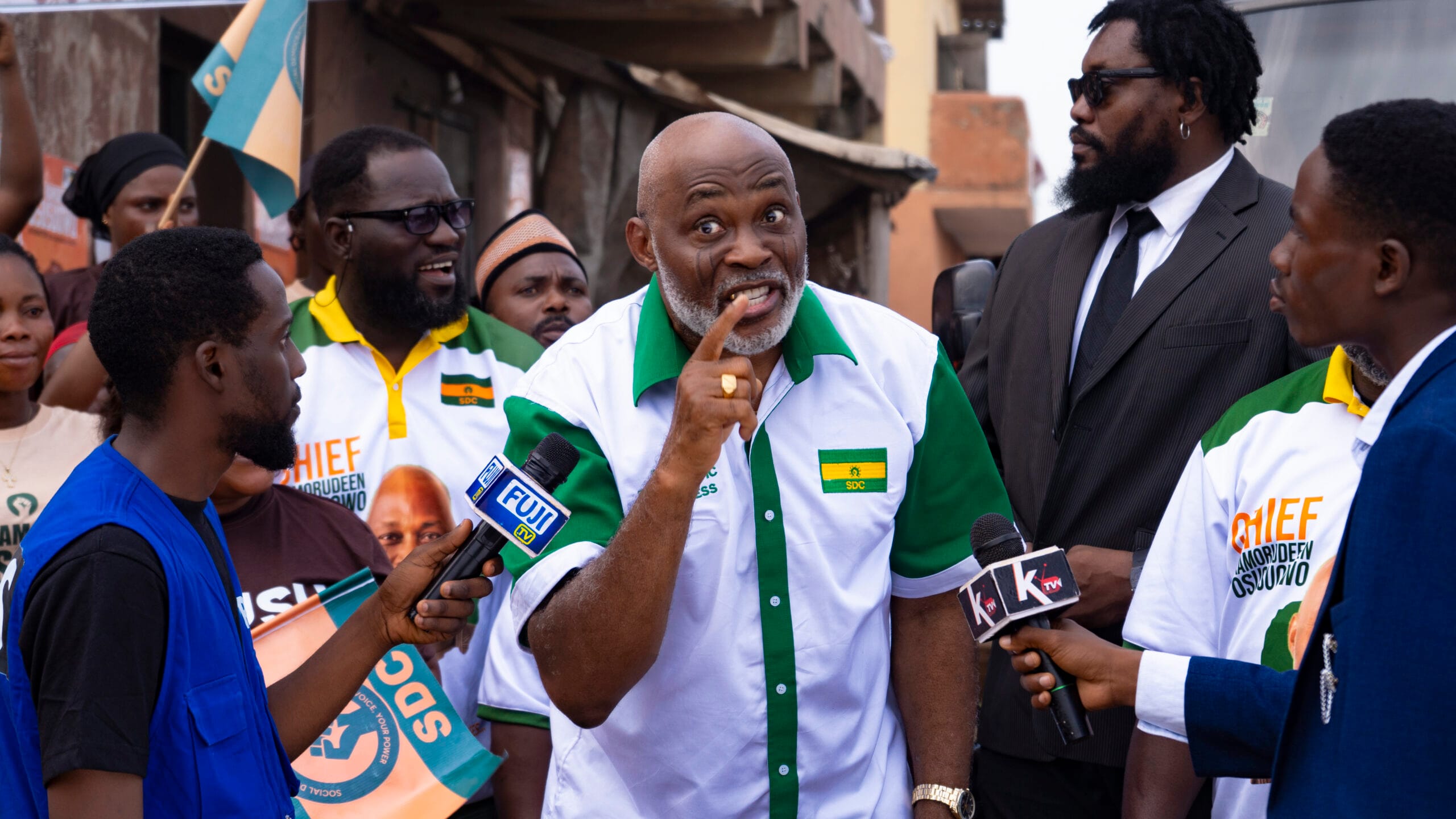 A man speaking amid a crowd